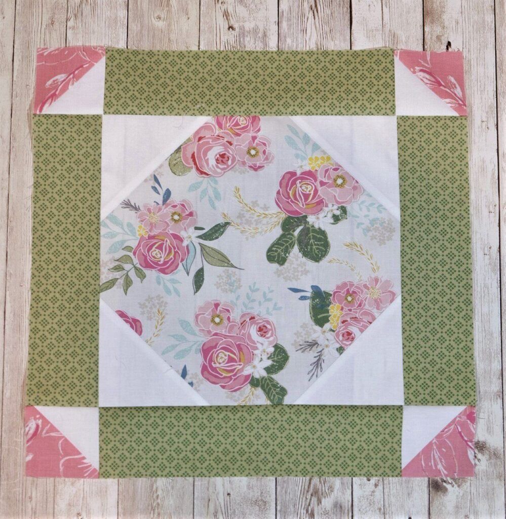 Snowball Quilt Block with borders green, pink, white