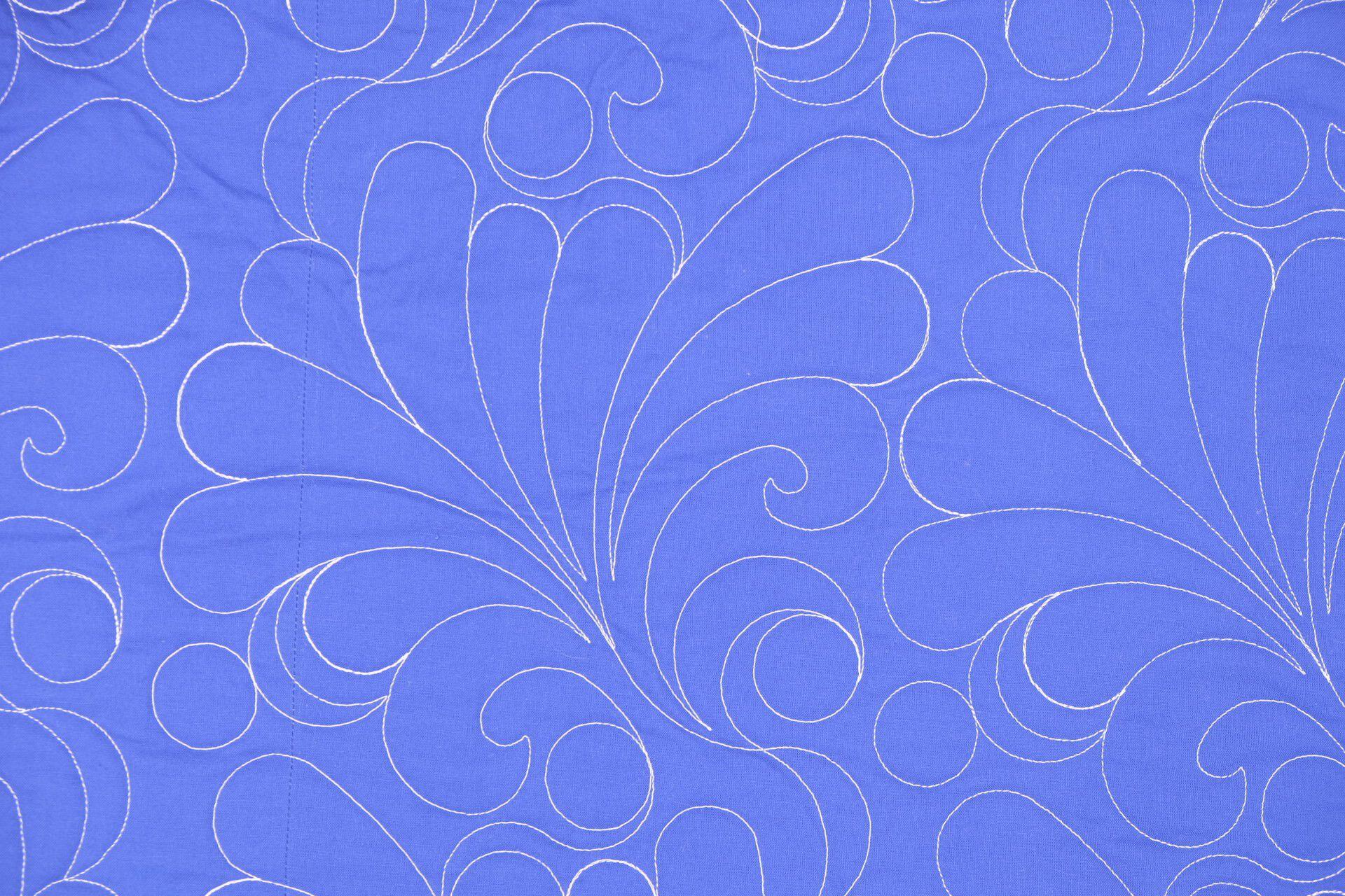 white quilting on blue background